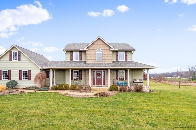 view of front facade featuring a front yard and a porch