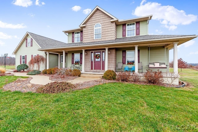 farmhouse inspired home with covered porch and a front lawn