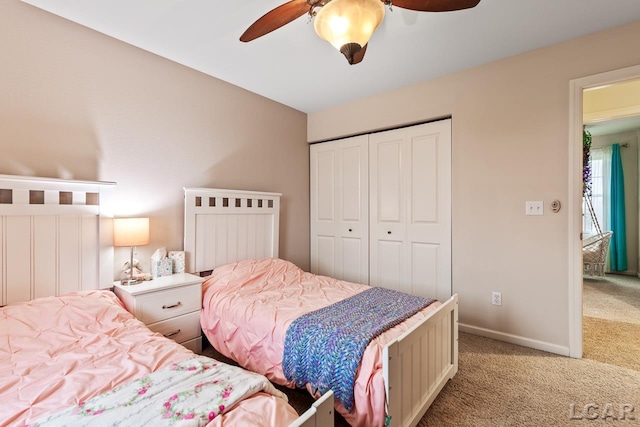 bedroom with carpet, a closet, and ceiling fan