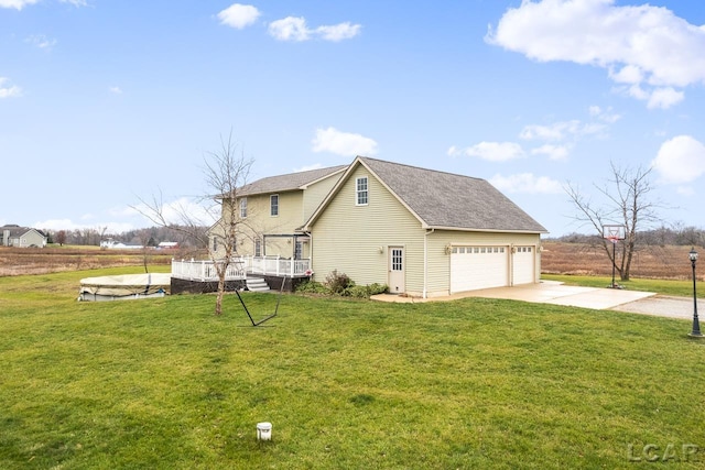 view of home's exterior featuring a garage and a lawn