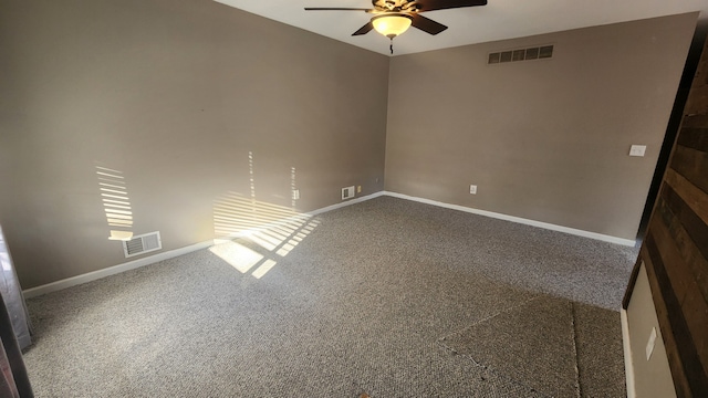 empty room with ceiling fan and carpet floors