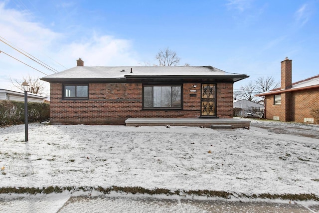 view of snow covered house