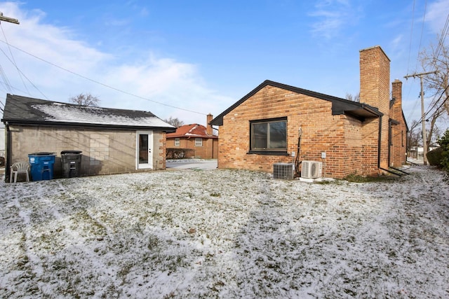 rear view of property with ac unit