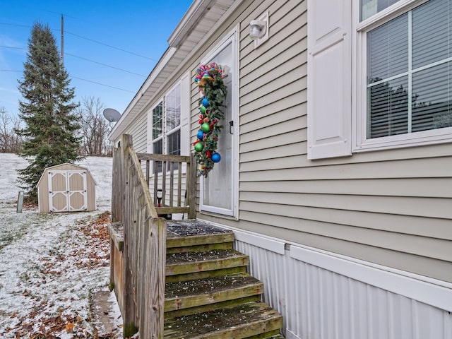 view of snow covered property entrance