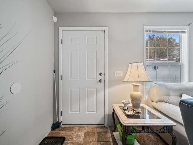 doorway to outside featuring tile patterned floors