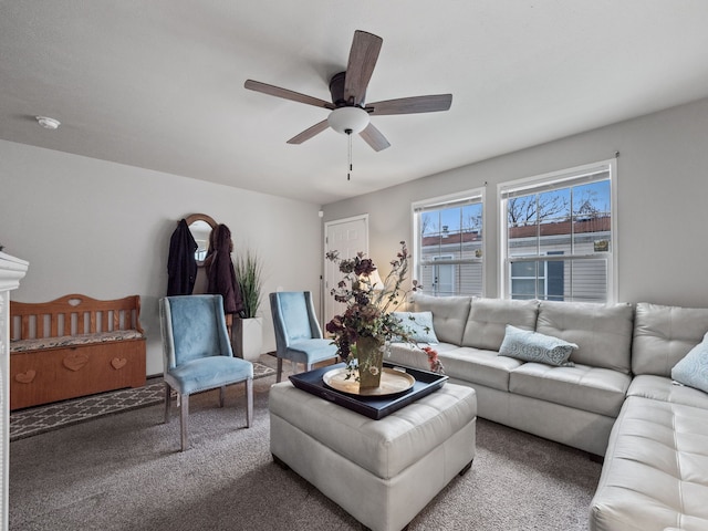 carpeted living room with ceiling fan