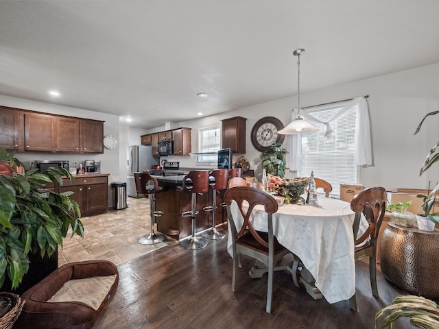 dining room with light wood-type flooring