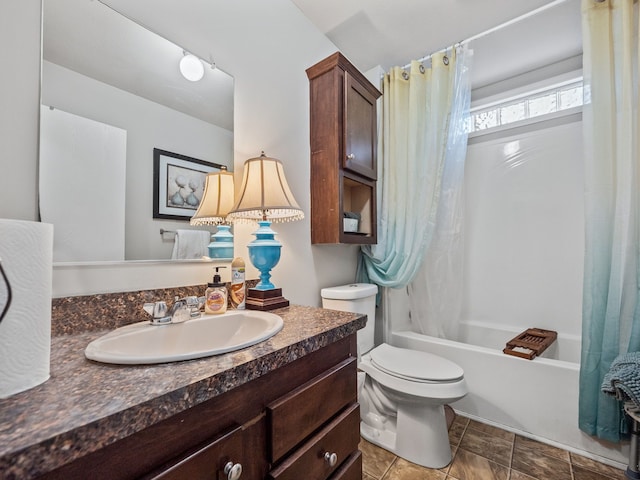 full bathroom featuring tile patterned floors, shower / bath combo, toilet, and vanity