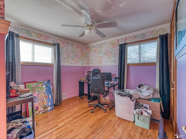 office area featuring light hardwood / wood-style floors, ceiling fan, and ornamental molding