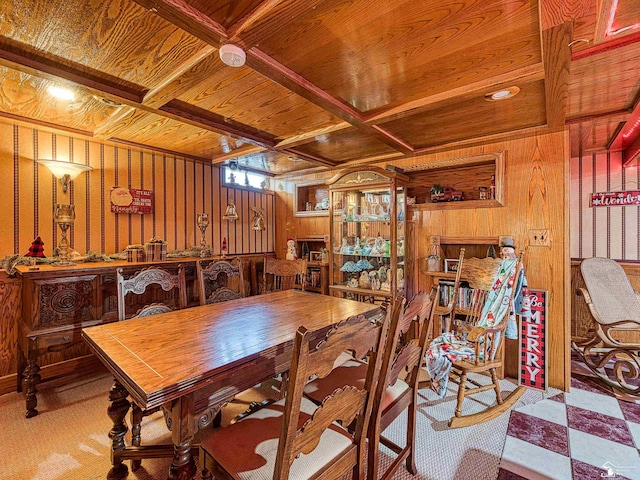 dining space featuring wooden walls and wooden ceiling