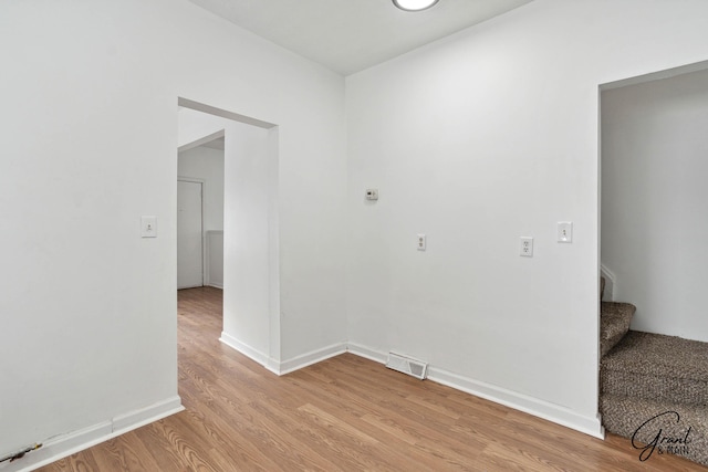 spare room featuring light hardwood / wood-style floors