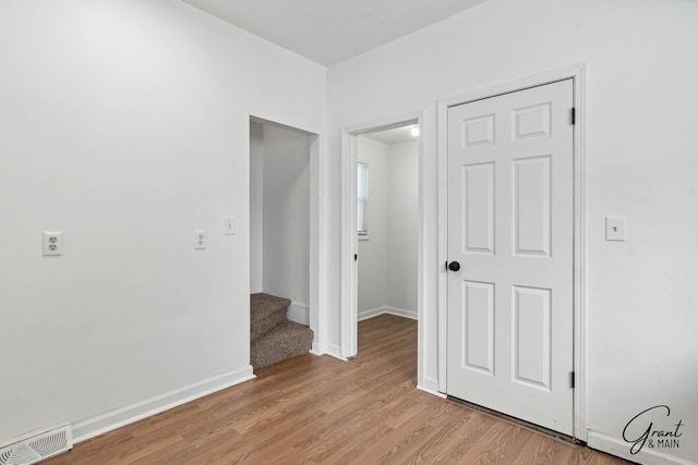 unfurnished room with light hardwood / wood-style floors