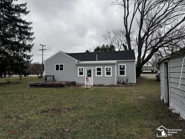 back of house with a yard