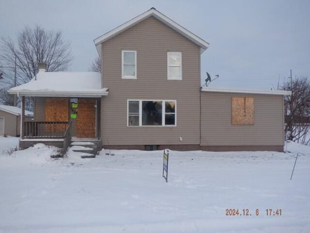 view of snow covered house