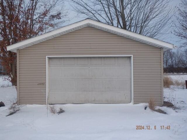 view of snow covered garage