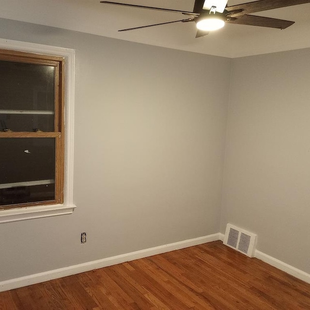 unfurnished room with hardwood / wood-style floors