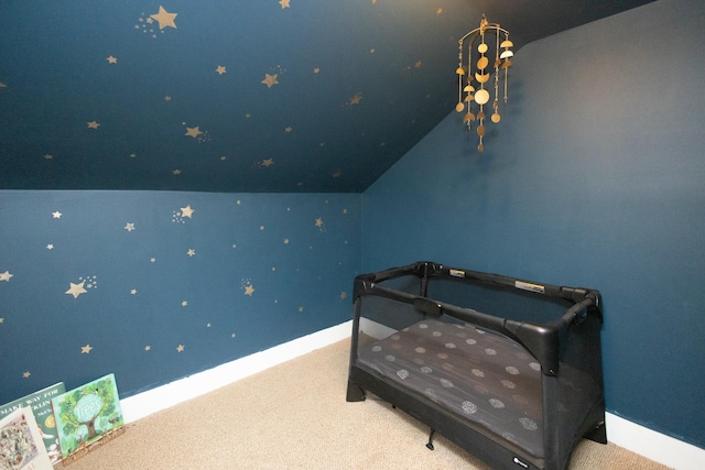 bedroom featuring carpet floors and vaulted ceiling