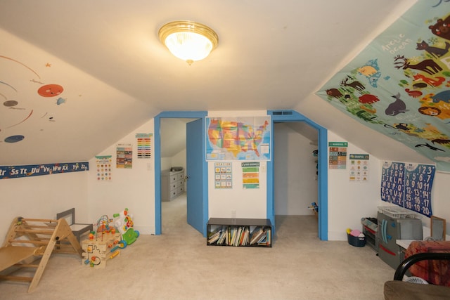 recreation room with carpet and lofted ceiling