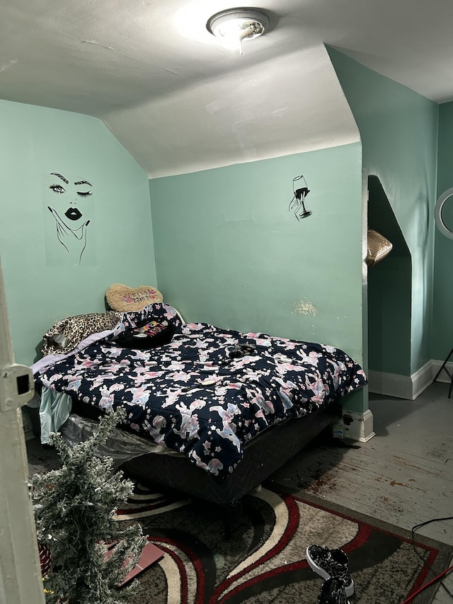 bedroom featuring lofted ceiling