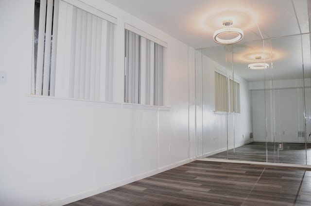 corridor featuring dark hardwood / wood-style flooring