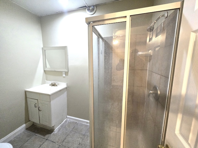 bathroom with vanity, tile patterned flooring, and a shower with shower door