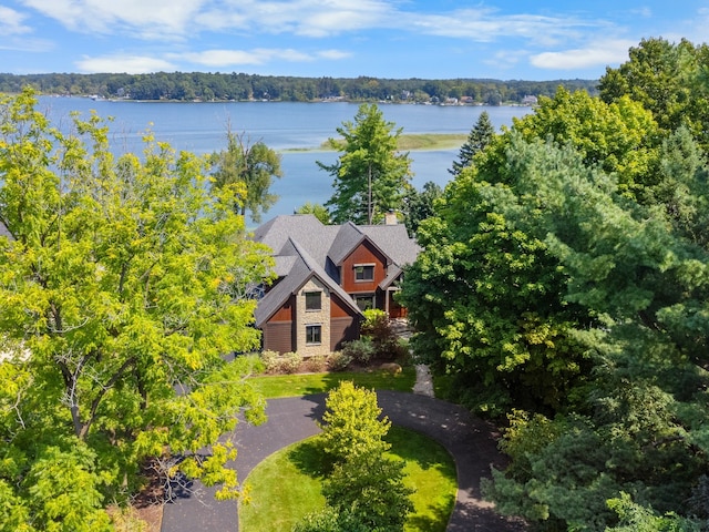 birds eye view of property with a water view