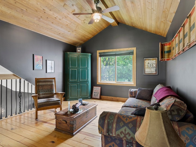 living room with vaulted ceiling with beams, ceiling fan, light hardwood / wood-style flooring, and wooden ceiling