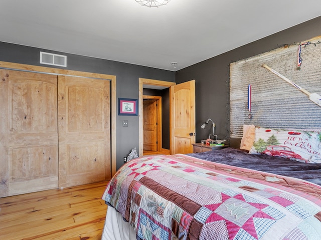 bedroom featuring a closet and wood-type flooring