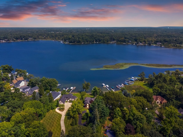 aerial view at dusk with a water view