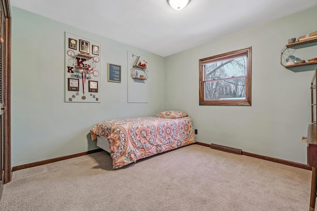 bedroom featuring light carpet