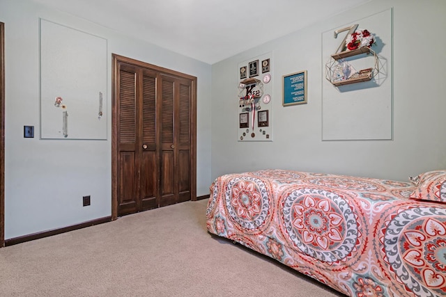 carpeted bedroom featuring a closet