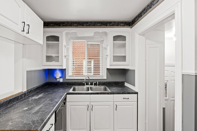 kitchen with sink, white cabinets, and stainless steel dishwasher