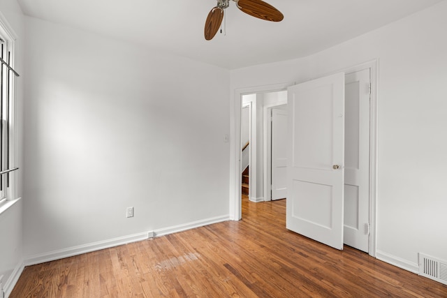 unfurnished room featuring wood-type flooring and ceiling fan