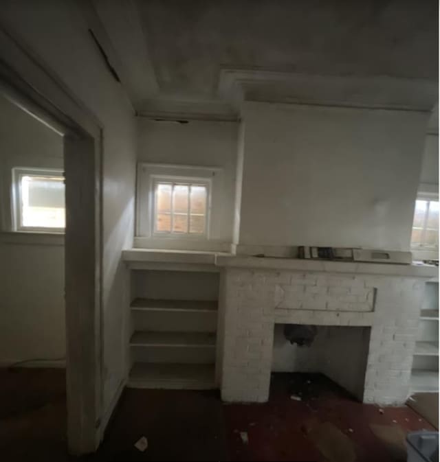 basement with a fireplace and plenty of natural light