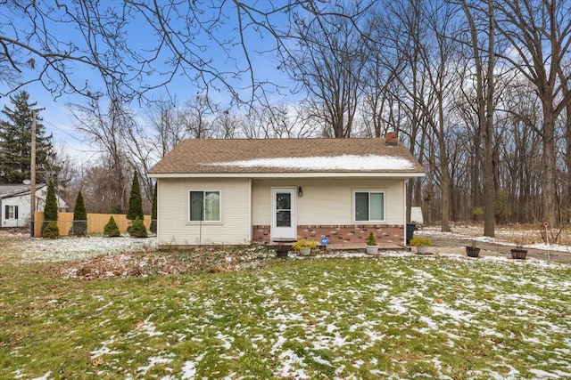 view of front of house with a yard