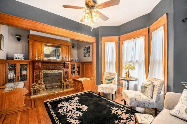 living room with a wealth of natural light, hardwood / wood-style floors, and ceiling fan