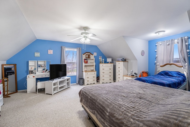 bedroom with ceiling fan, carpet floors, and vaulted ceiling