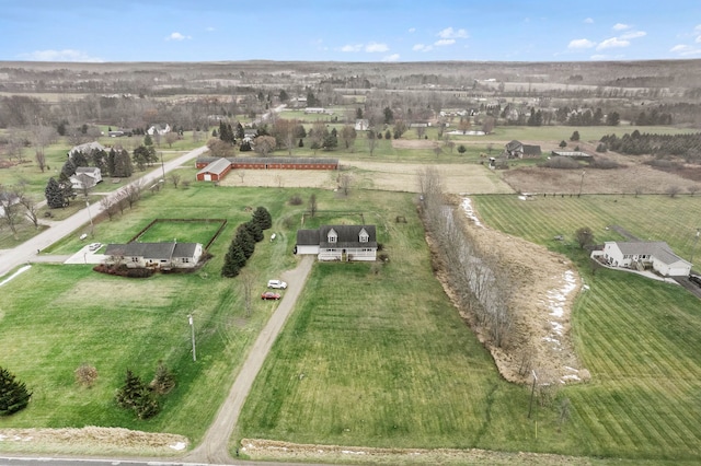 birds eye view of property with a rural view