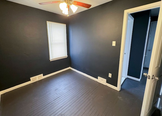 unfurnished room featuring dark hardwood / wood-style flooring and ceiling fan