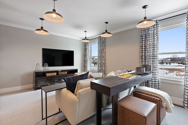 dining area with light carpet, crown molding, and a healthy amount of sunlight