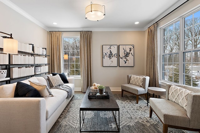 living room with hardwood / wood-style floors, plenty of natural light, and crown molding