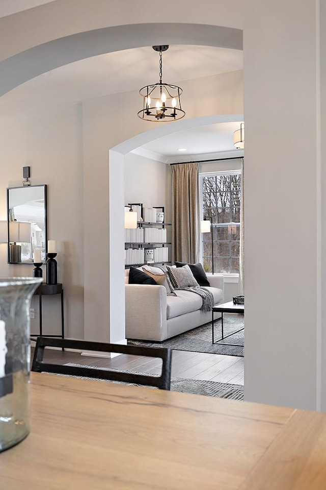 living room featuring a chandelier and hardwood / wood-style flooring