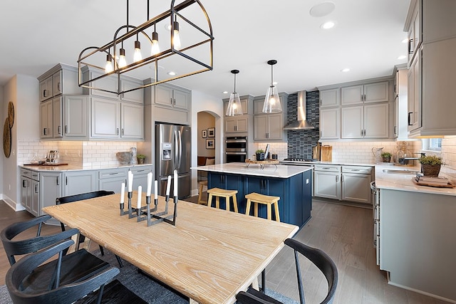 dining area with dark hardwood / wood-style flooring and sink