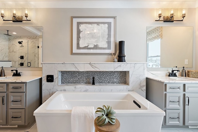 bathroom featuring vanity and separate shower and tub