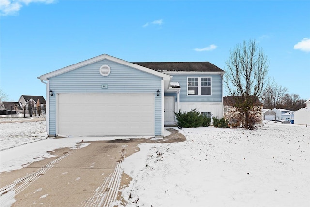 view of front of property with a garage