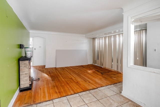 unfurnished room with light hardwood / wood-style flooring