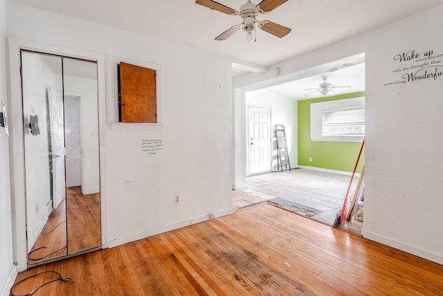 unfurnished room featuring ceiling fan and wood-type flooring