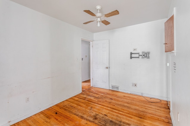 unfurnished room with ceiling fan and light hardwood / wood-style floors