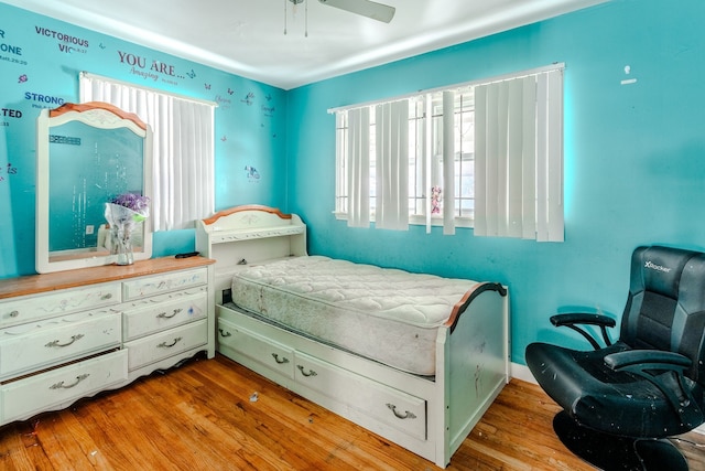 bedroom featuring ceiling fan and light hardwood / wood-style flooring