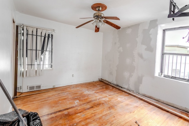 spare room with ceiling fan and hardwood / wood-style floors